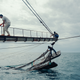 Staff on a ship near Guinea-Bissau try to release a strut that has become stuck.